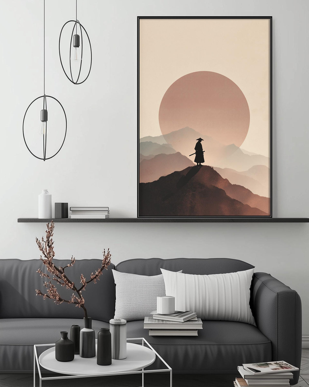 a living room with a gray sofa, a coffee table, and a large framed artwork depicting a person in a cowboy hat standing on a mountain peak with a large sun in the background.