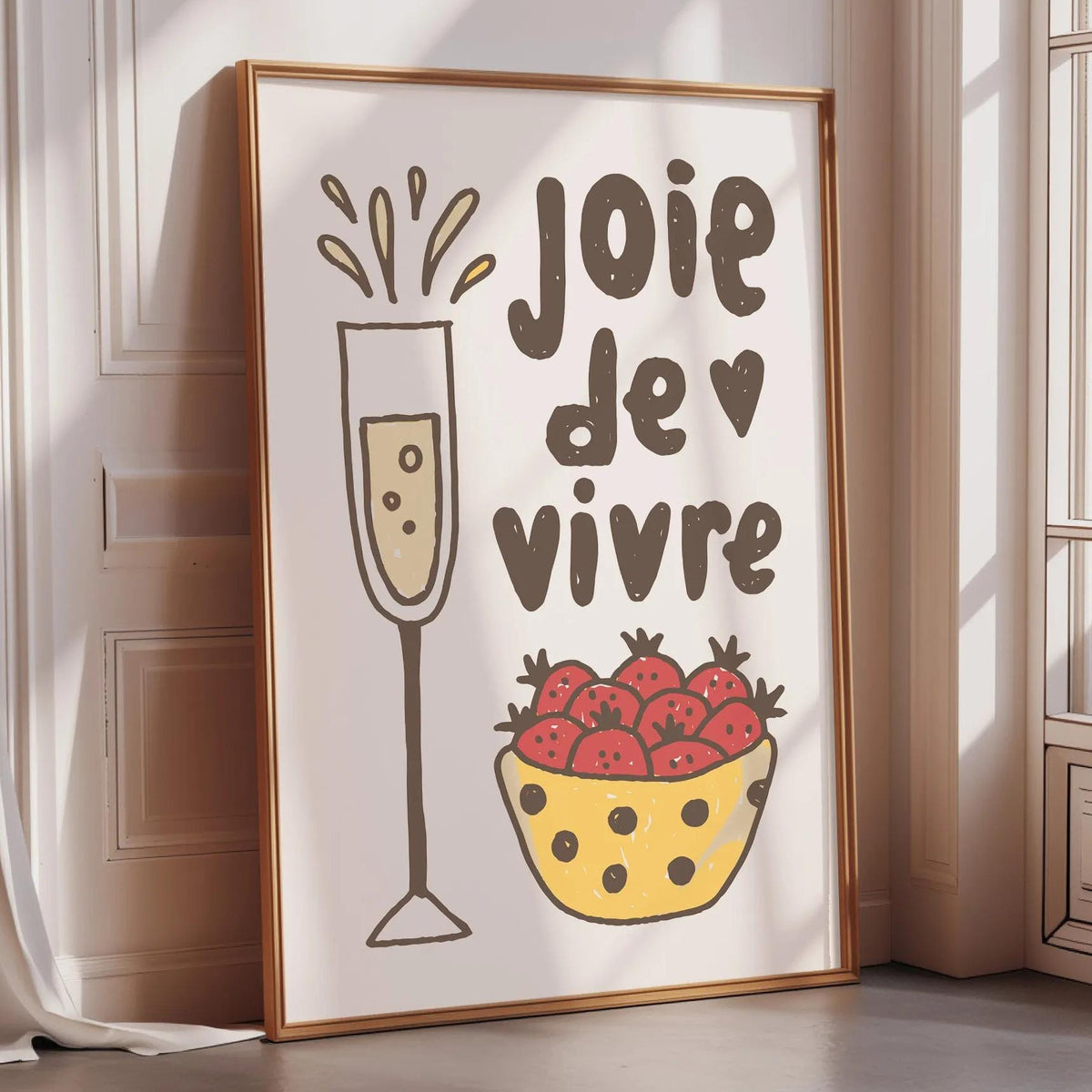 A framed poster with a glass of champagne and a bowl of strawberries, accompanied by the text "Joie de vivre" (French for "joy of life")