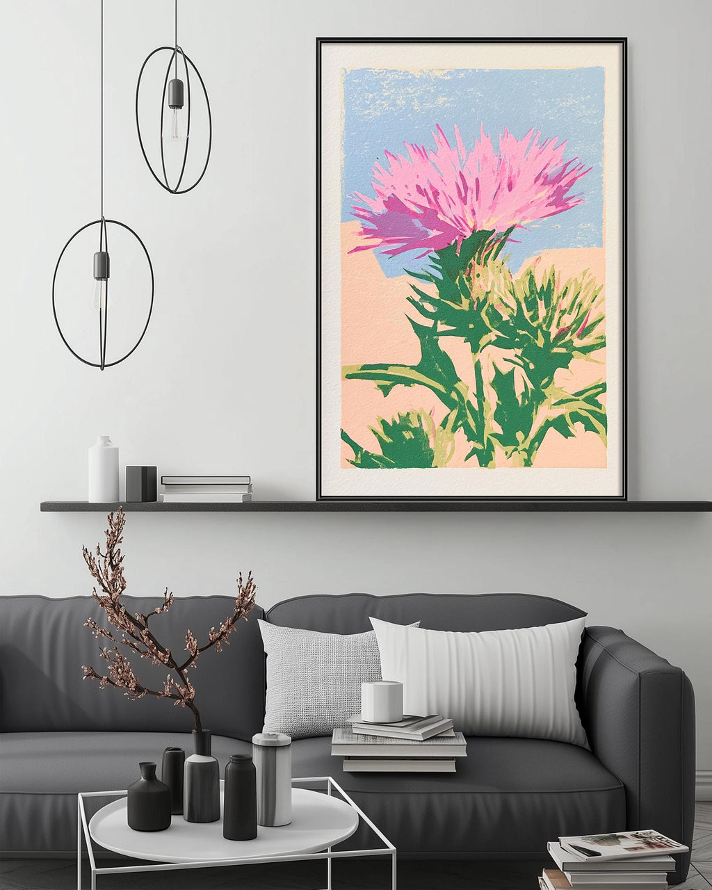 a living room with a gray sofa, a coffee table, and a large framed print of a colorful flower on the wall above the sofa.