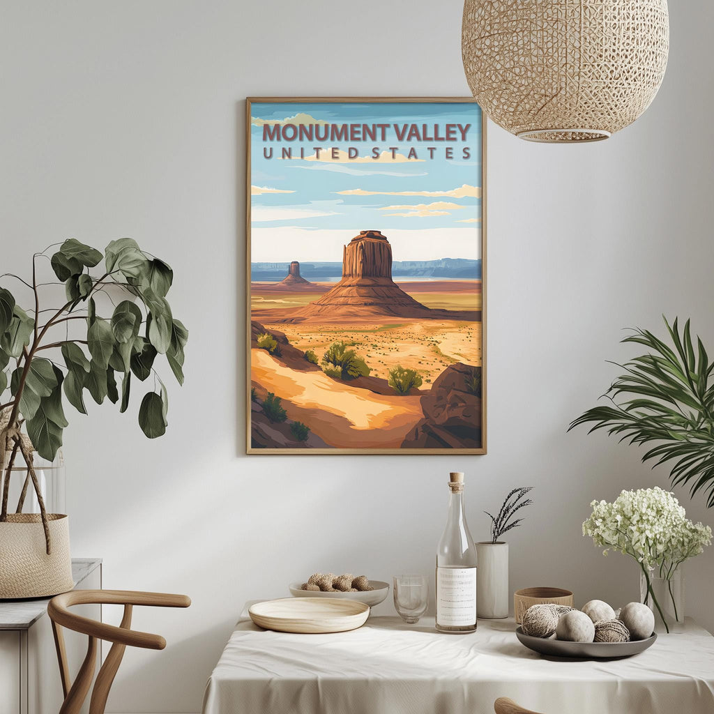 a framed poster of Monument Valley, a famous landmark in the United States, hanging on a wall above a dining table with various decorative items and plants.