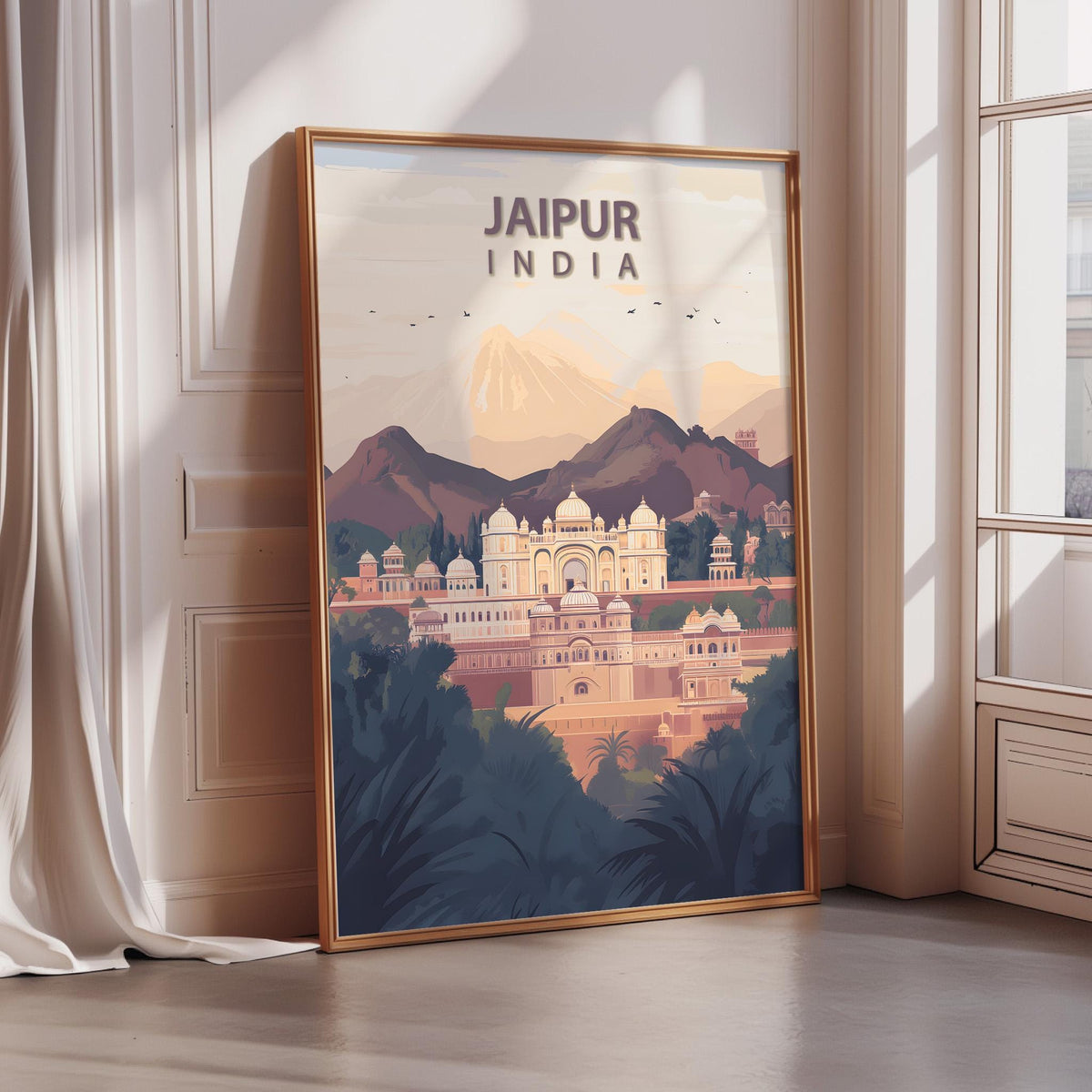 A framed poster depicting the city of Jaipur, India, with a mountainous landscape in the background.