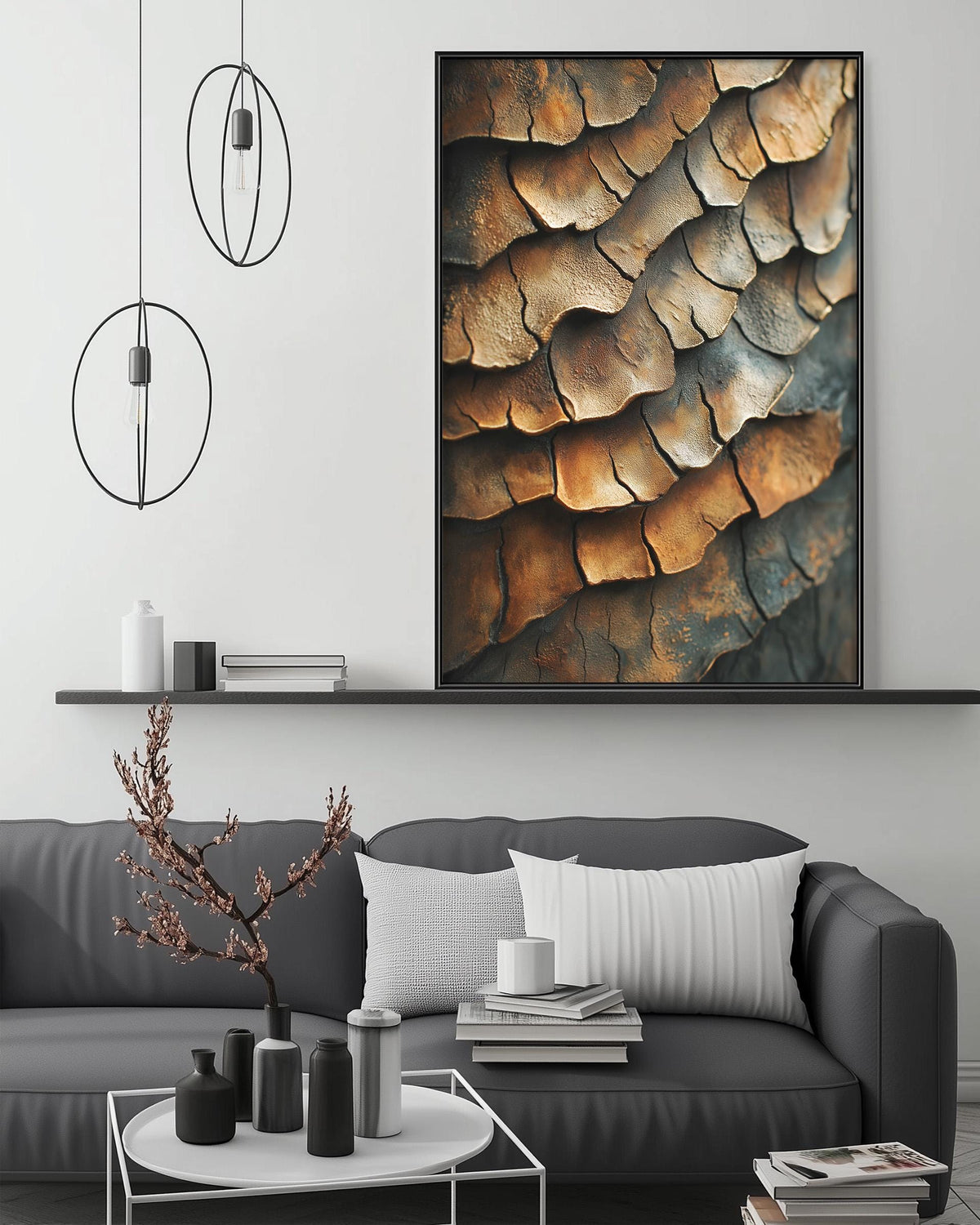 a modern living room with a gray sofa, a coffee table, and a large framed print of a textured surface hanging on the wall above the sofa.