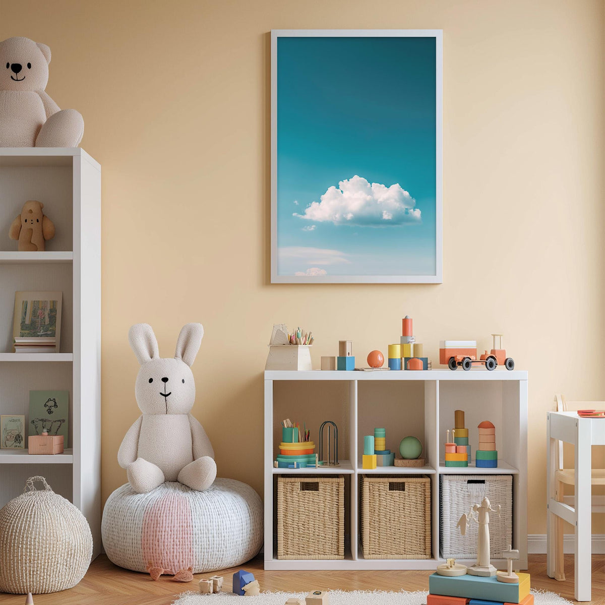 A cozy children's room with a white rabbit sitting on a bean bag chair, surrounded by toys and storage bins. A framed picture of a blue sky with a fluffy white cloud hangs on the wall above a white bookshelf filled with various toys and books.