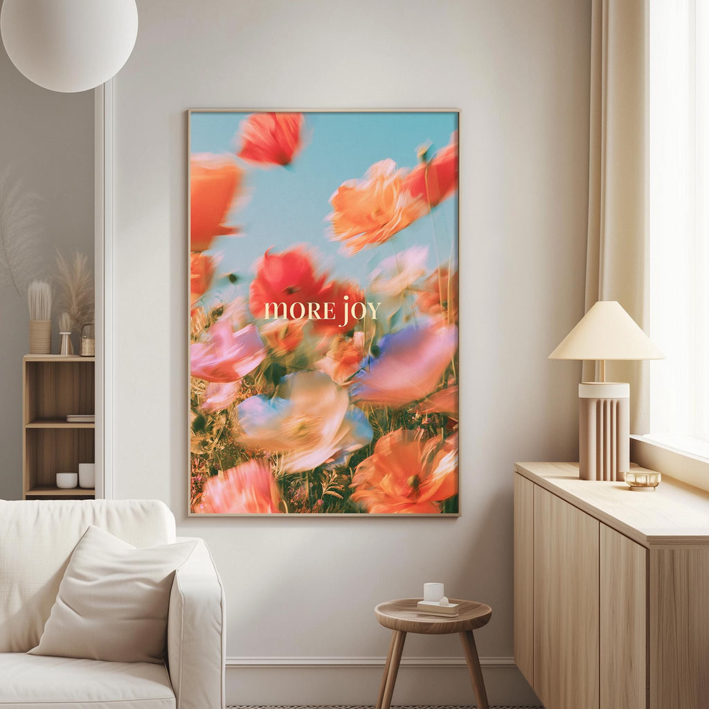a large, vibrant painting of flowers hanging on a wall in a living room.