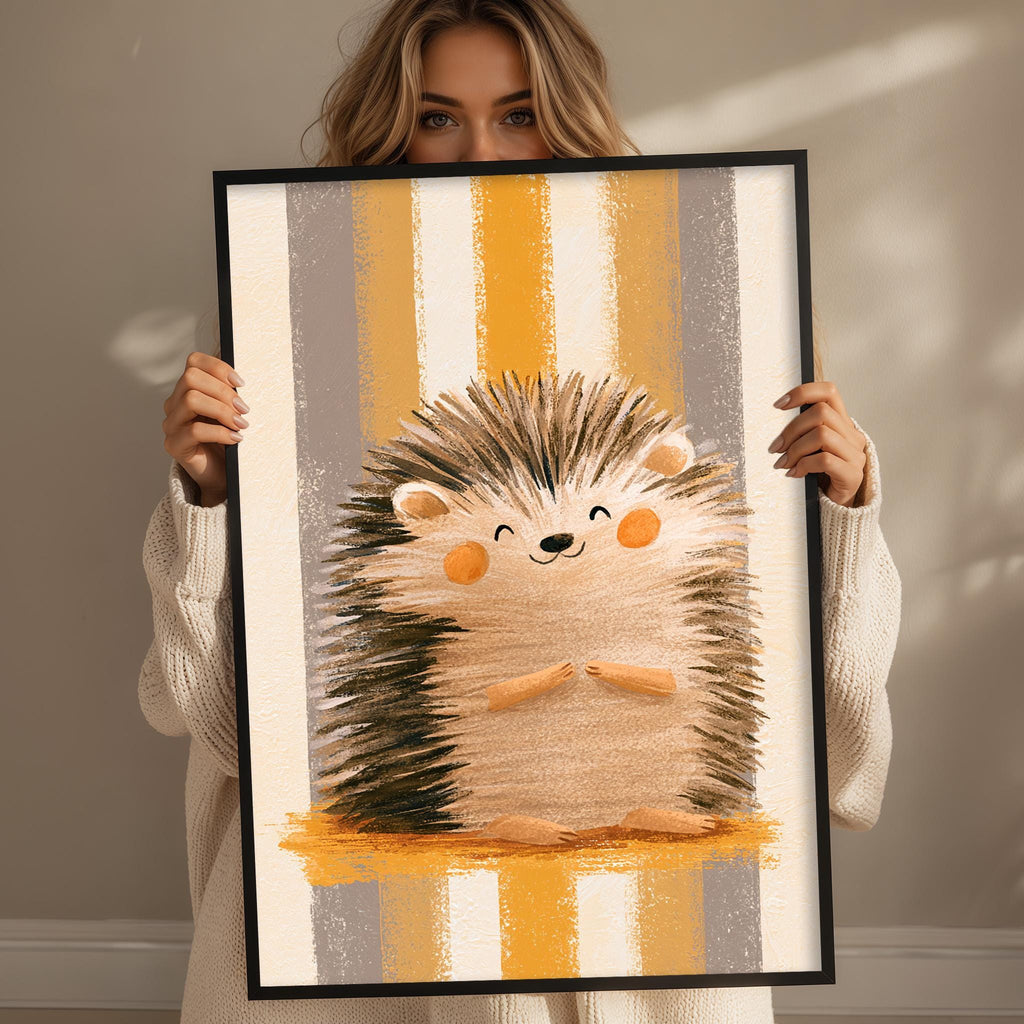 A woman holding a framed picture of a smiling hedgehog.