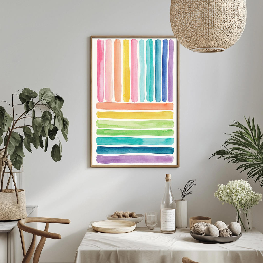 a dining table with a white tablecloth, a bowl of fruit, a bottle, and a vase with flowers. Above the table, there is a framed picture with a colorful abstract design. The table is set with a variety of items, including a potted plant, a plant in a vase, and a bowl of fruit.
