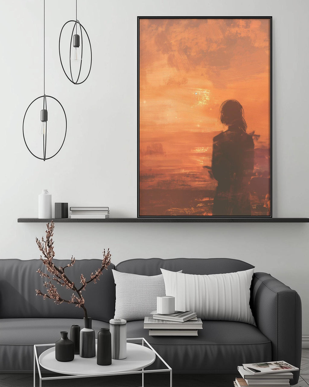 a modern living room with a gray sofa, a coffee table, and a large framed artwork depicting a sunset. The artwork is hanging on the wall above the sofa, creating a focal point in the room.