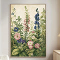 a large floral painting hanging on a wall in a living room, depicting a lush garden scene with various flowers and plants.