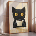 A framed painting of a black cat holding a cup of coffee, with a yellow cat eye design on its face.