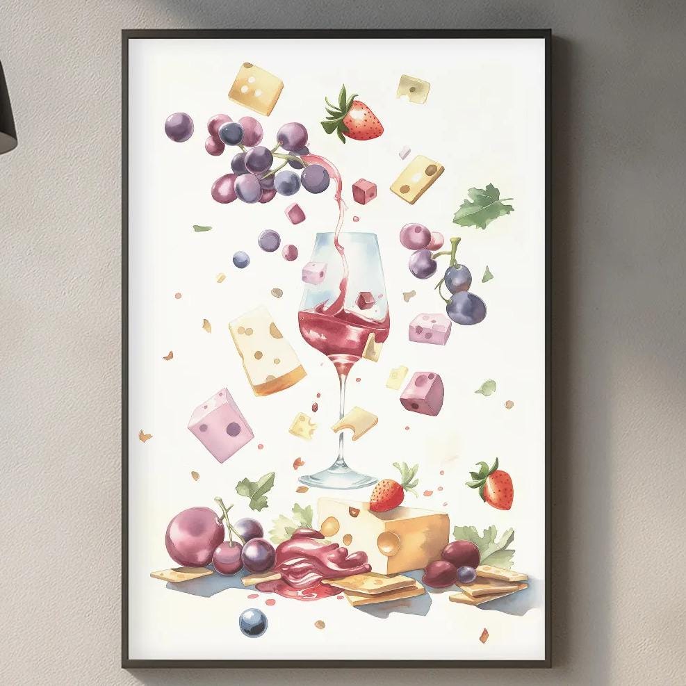 a kitchen counter with various kitchen items, including a wine glass, a cutting board, and a plant. Above the counter, there is a framed print depicting a collage of food items, such as grapes, cheese, and a bowl of fruit.