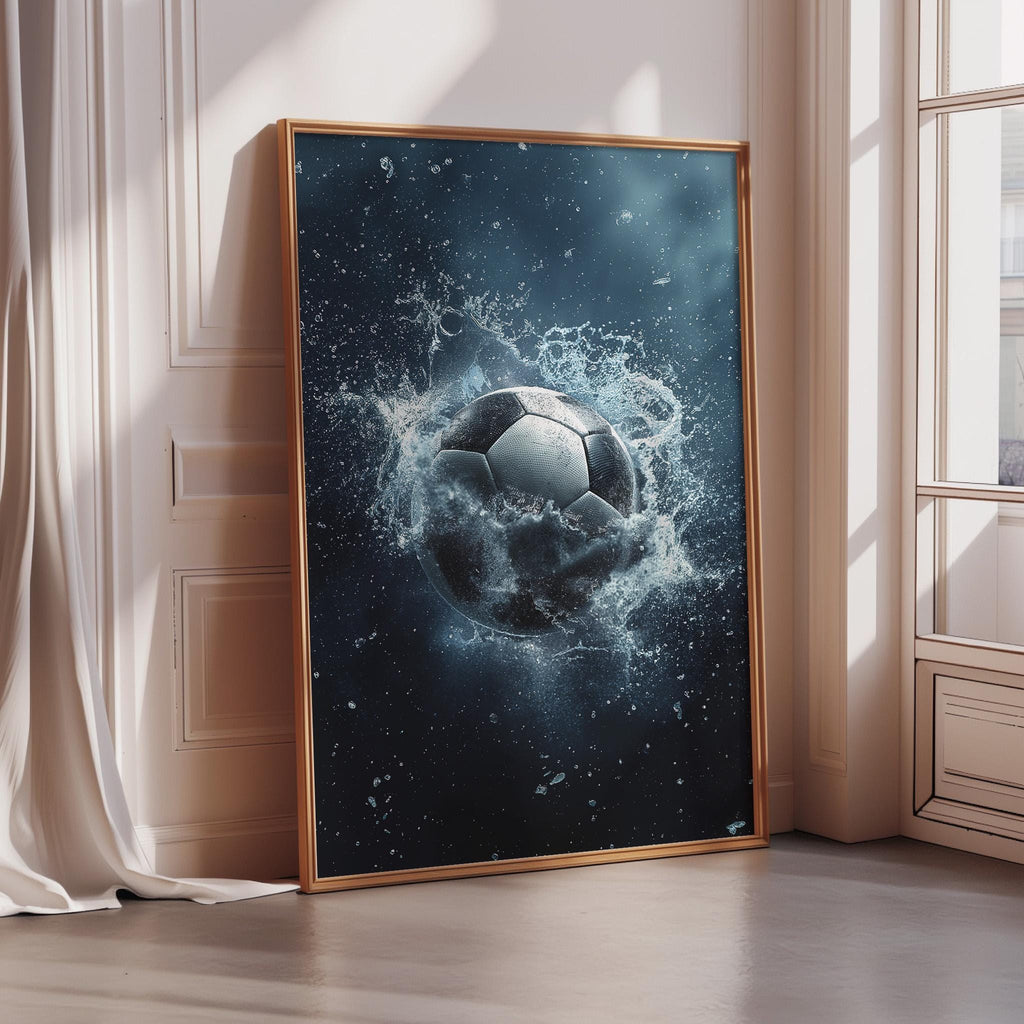 A framed poster depicting a soccer ball surrounded by splashing water, creating a dynamic and energetic scene.