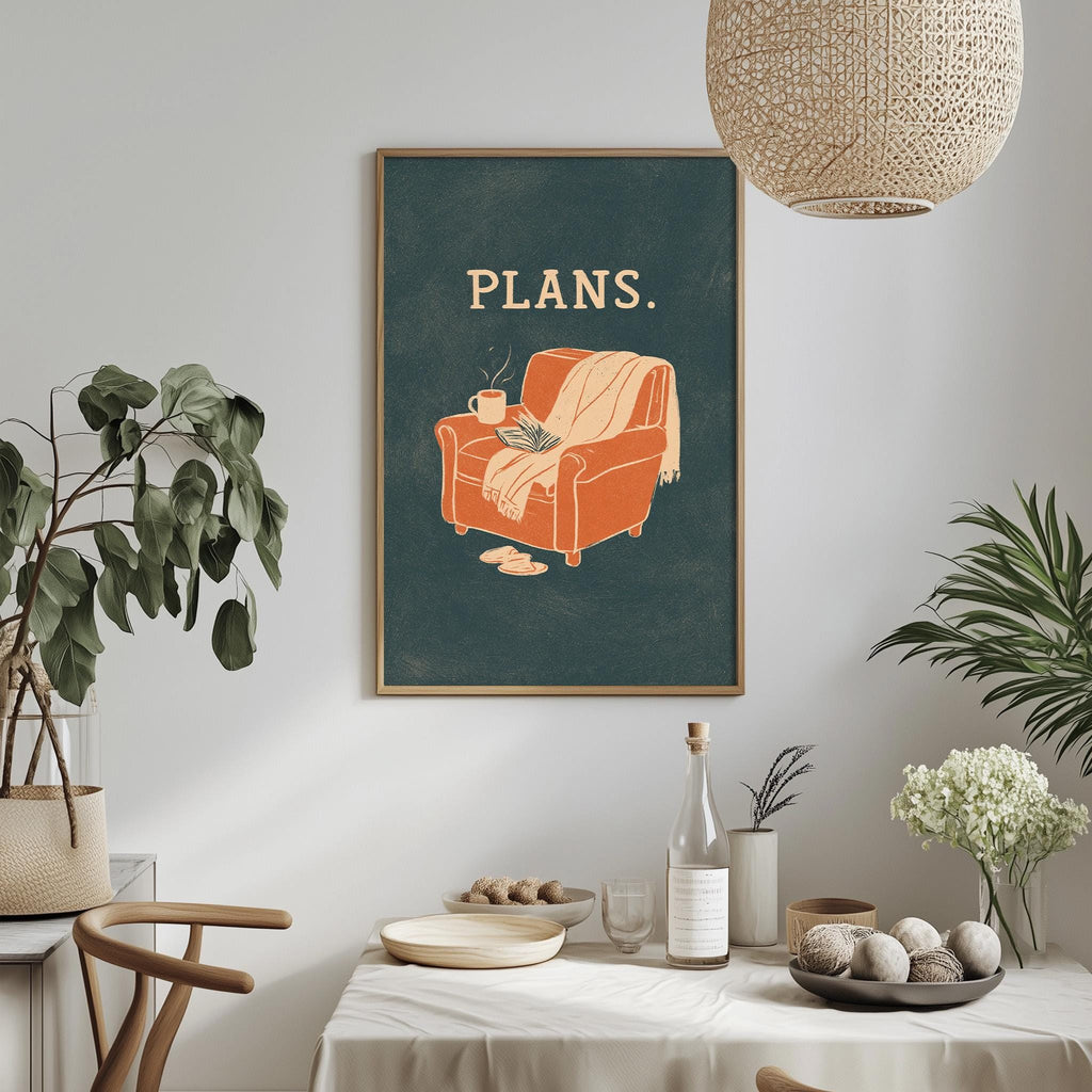 a cozy living room with a framed poster of an orange armchair and a green wall, a hanging lamp, and a dining table with a vase of flowers and a bottle of wine.