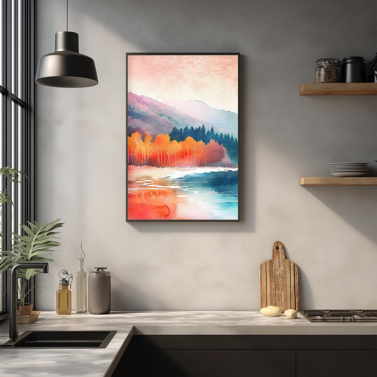 a kitchen counter with a framed painting of a serene landscape hanging above it. The painting depicts a tranquil scene of a lake surrounded by mountains, with trees and a blue sky in the background. The kitchen counter has various items on it, including a cutting board, a bottle, and a vase.