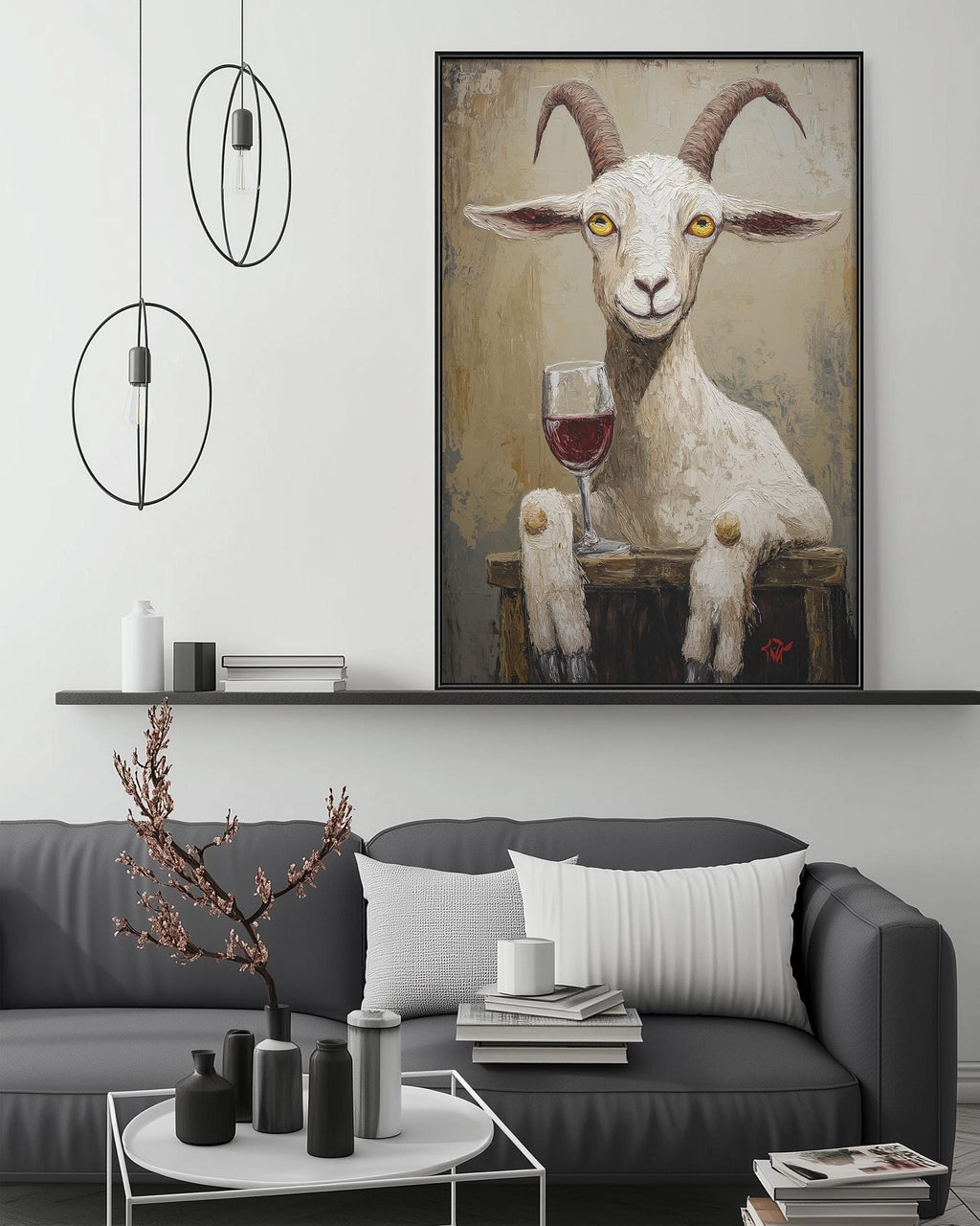 a large painting of a goat holding a glass of wine, hanging on a wall above a gray couch with a coffee table in front of it.