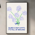a framed poster with a blue and white design of flowers and the text "Silence is not empty; it's full of answers" hanging on a wall above a kitchen counter.