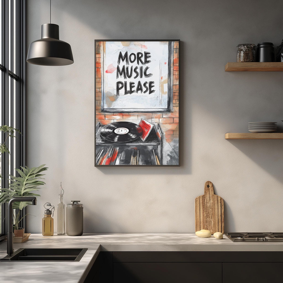 a kitchen counter with various items, including a record player, a cutting board, and some bottles. Above the counter, there is a framed poster that says "MORE MUSIC PLEASE".
