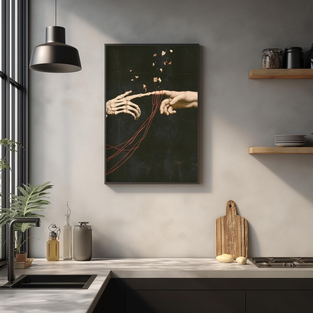 a modern kitchen with a large framed artwork depicting two hands reaching towards each other, surrounded by red strings. The kitchen counter has various items such as a cutting board, a bottle, and a vase. The overall scene has a minimalist and artistic feel, with the focus on the hands and the strings connecting them.
