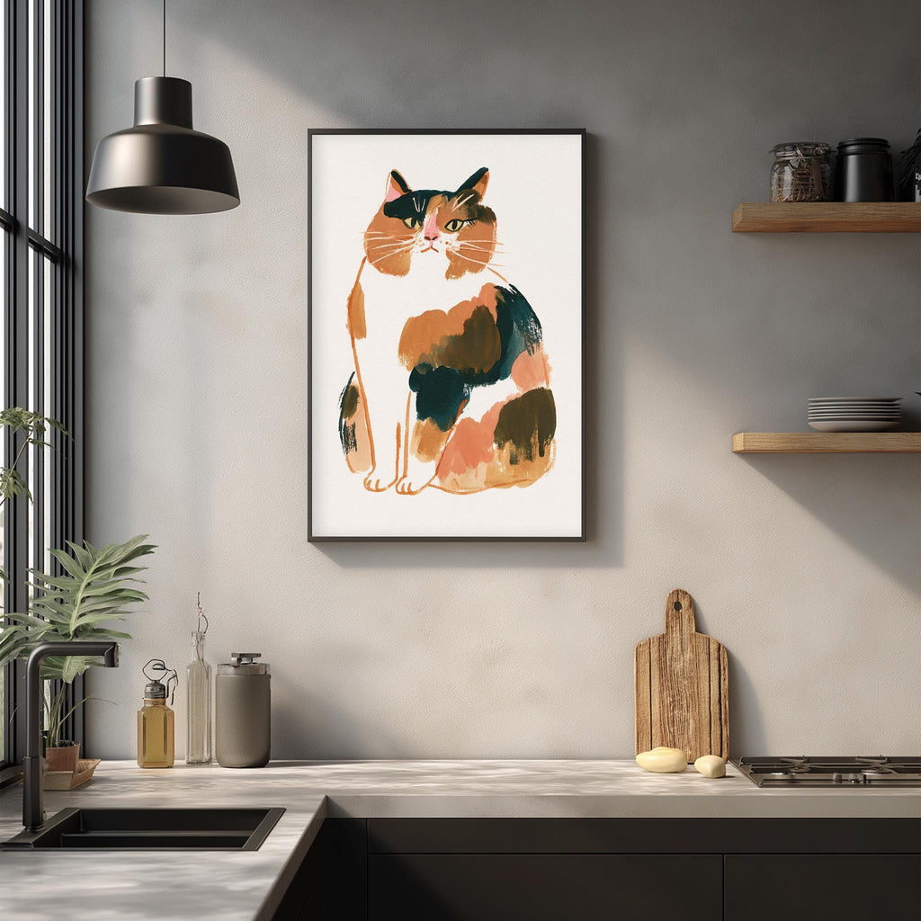 a framed illustration of a cat sitting on a white background, hanging on a wall above a kitchen counter.