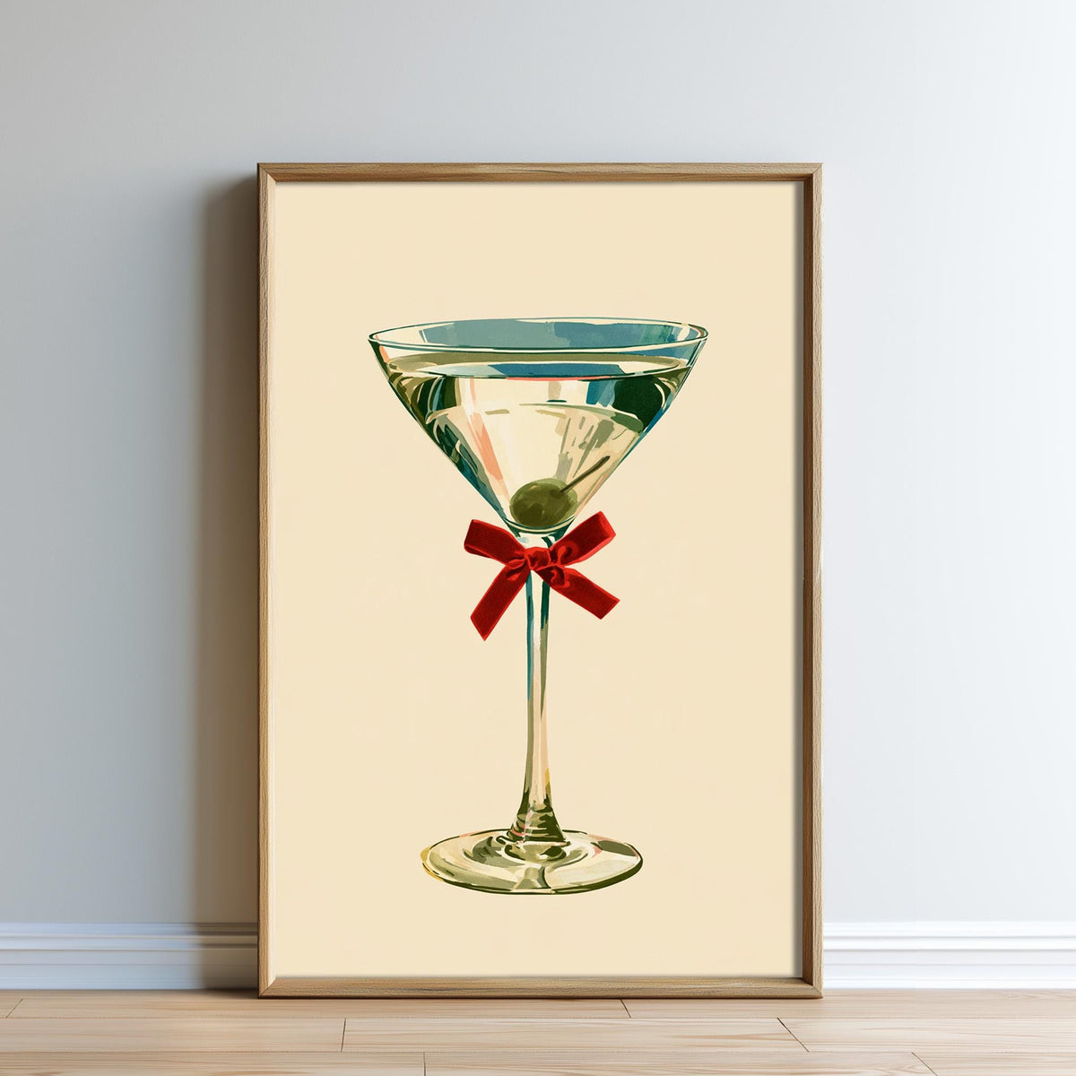 A framed illustration of a martini glass with a red ribbon.