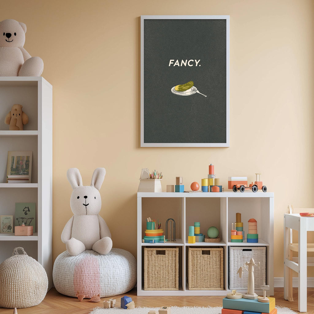 A cozy children's room with a white bookshelf, a plush rabbit, and a toy train. The walls are painted a light peach color, and there is a framed poster with the word "Fancy" on the wall.