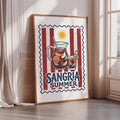 A framed poster with a vibrant illustration of a pitcher filled with a refreshing drink, surrounded by various fruits and a sun, promoting the concept of "Sangria Summer".