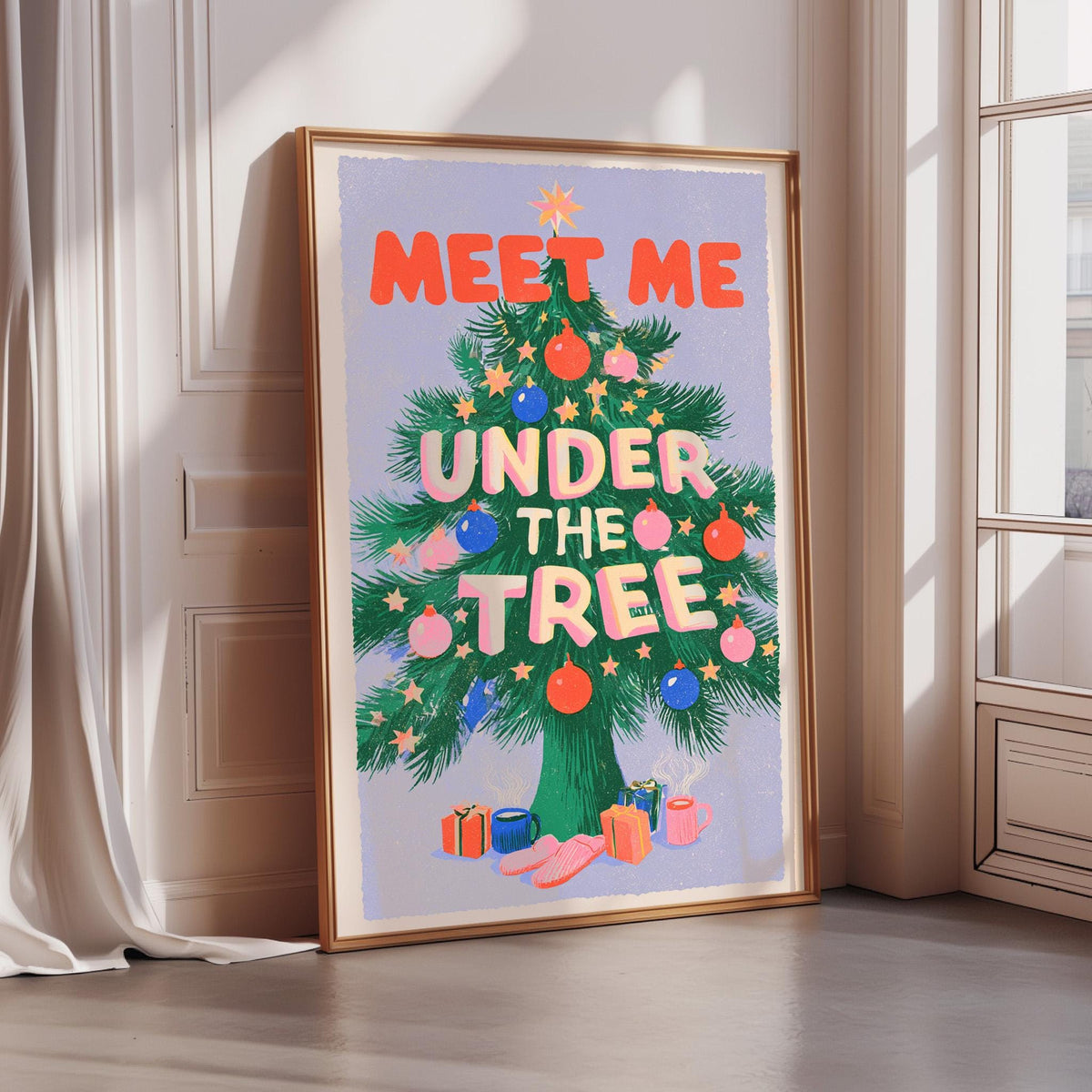 A framed poster with the text "MEET ME UNDER THE TREE" and an illustration of a Christmas tree with ornaments and presents.