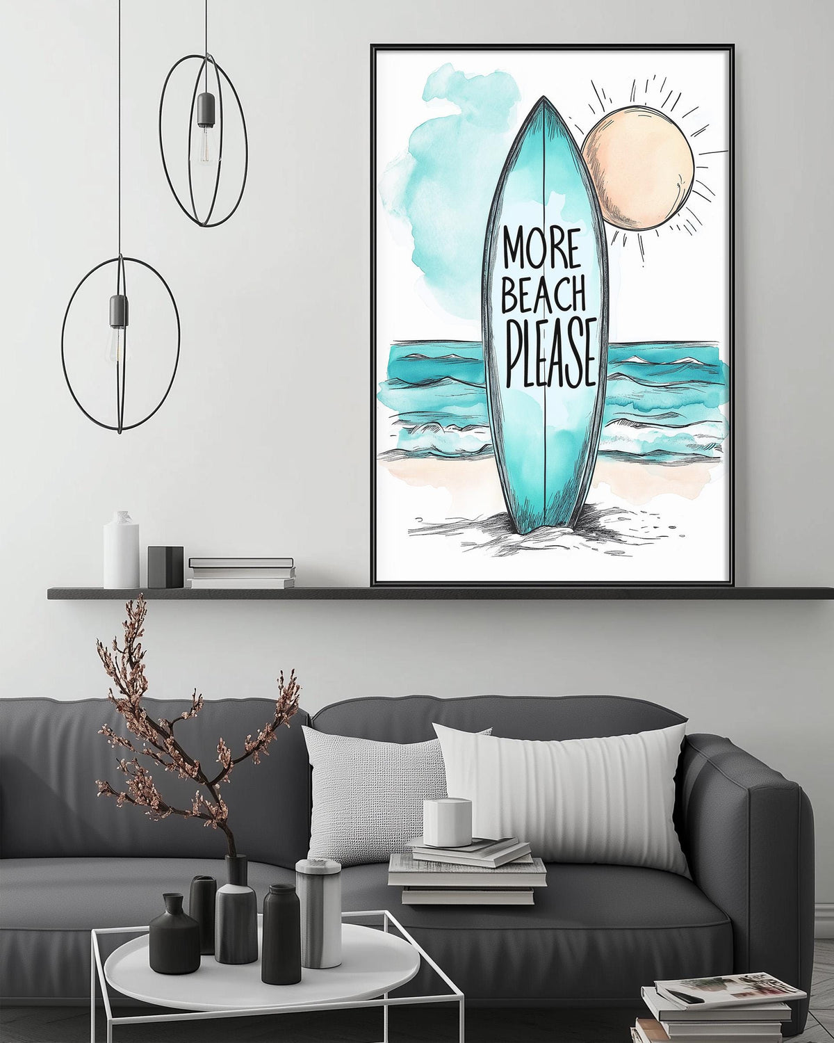 a living room with a gray couch, a coffee table, and a framed poster of a surfboard with the text "MORE BEACH PLEASE" above it. The poster is hanging on the wall above the couch.