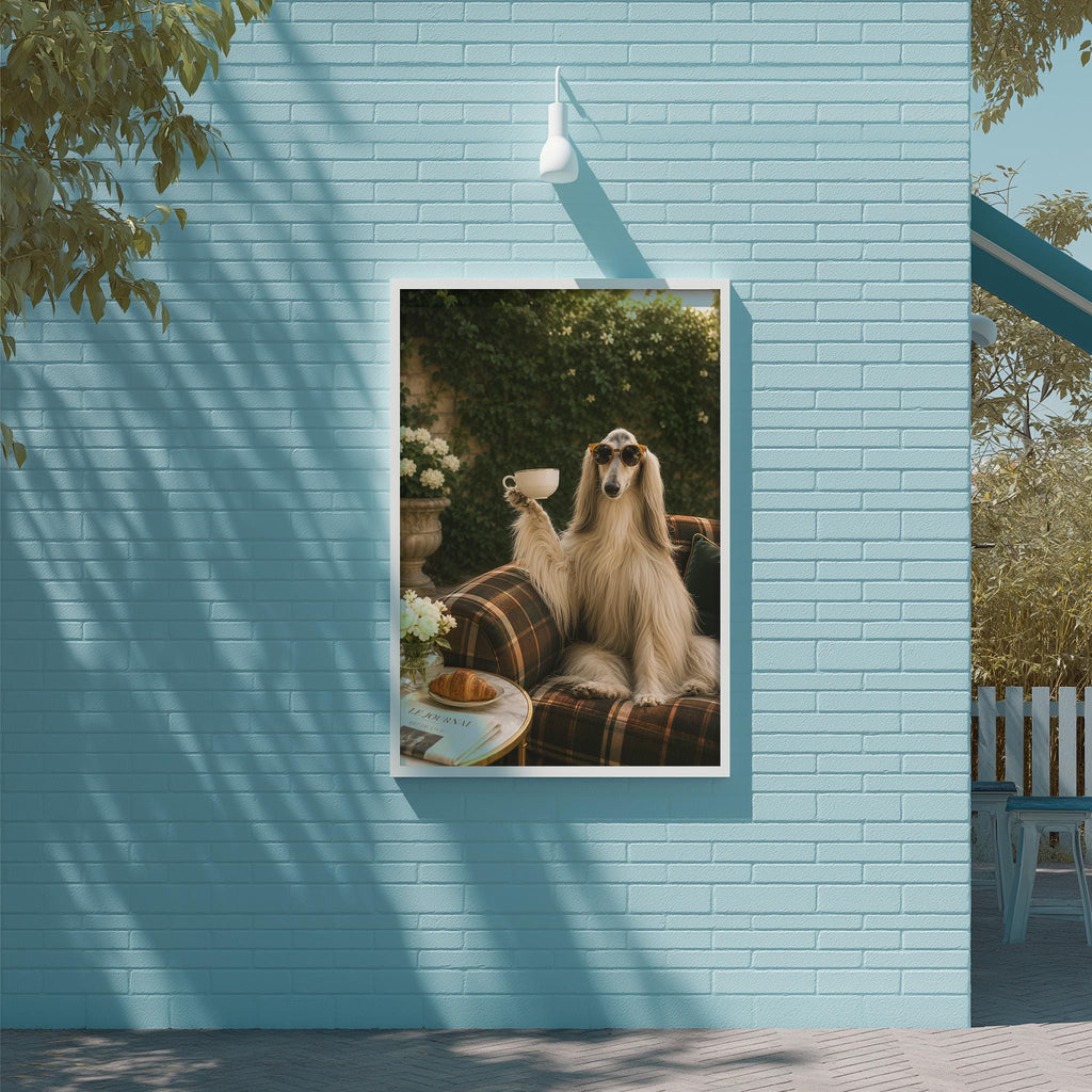 A large framed photograph of a dog sitting on a couch, holding a cup and appearing to enjoy a beverage, is displayed on a blue wall.