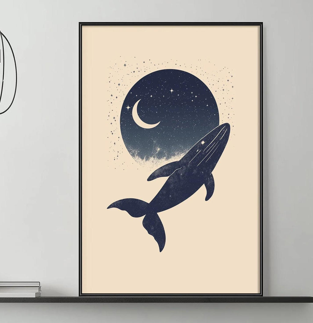 a living room with a gray sofa, a coffee table, and a framed artwork depicting a whale against a night sky with a crescent moon.