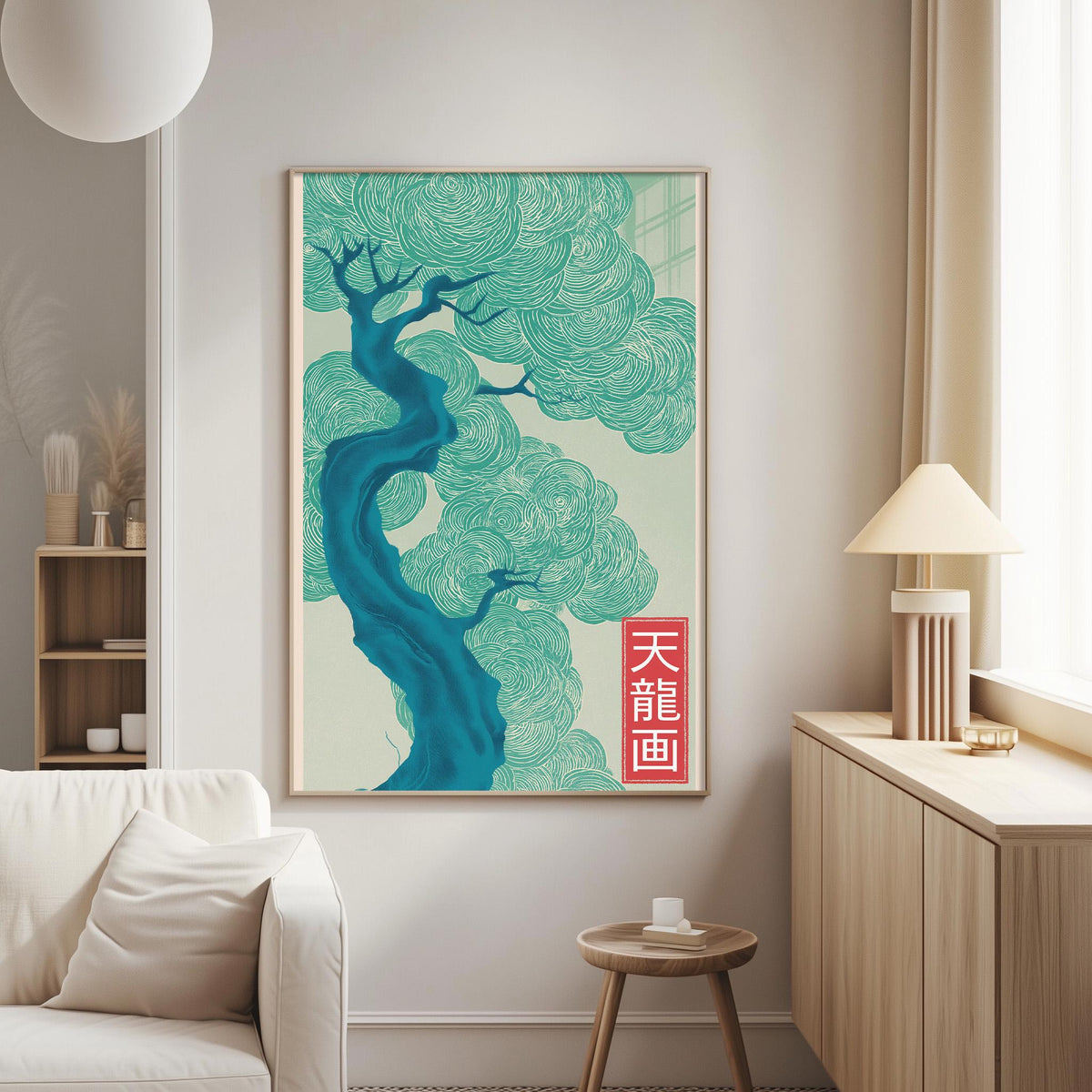 a living room with a large framed poster of a tree with blue and green swirls hanging on the wall. The poster is framed in a light wood color and has a red Chinese character on it. The room also includes a white couch, a small table, and a lamp.
