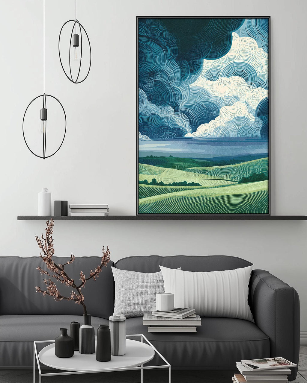 a modern living room with a gray sofa, a coffee table, and a large framed landscape painting hanging on the wall above the sofa.