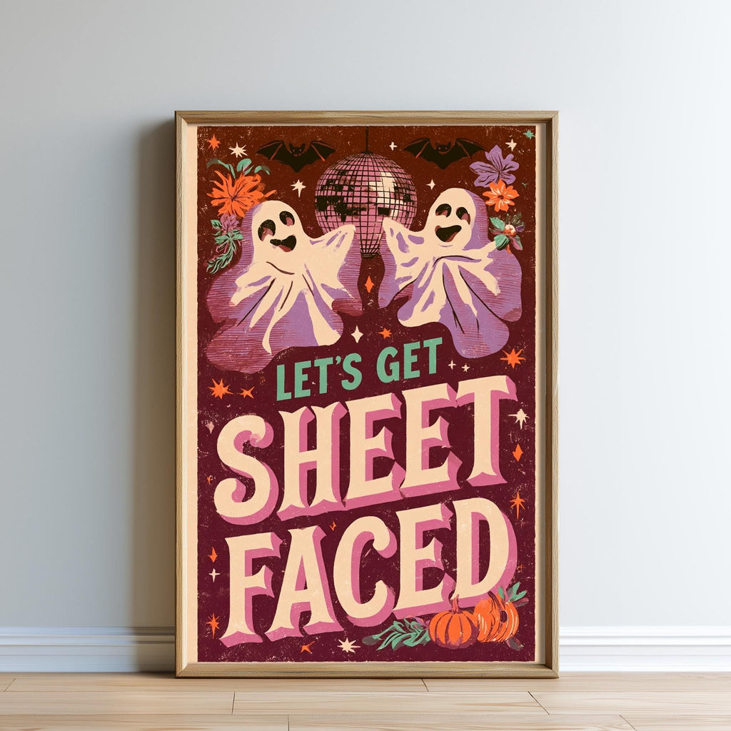 The image is a framed poster with a Halloween theme, featuring two ghostly figures and a disco ball. The text on the poster reads "Let's Get Sheetfaced".