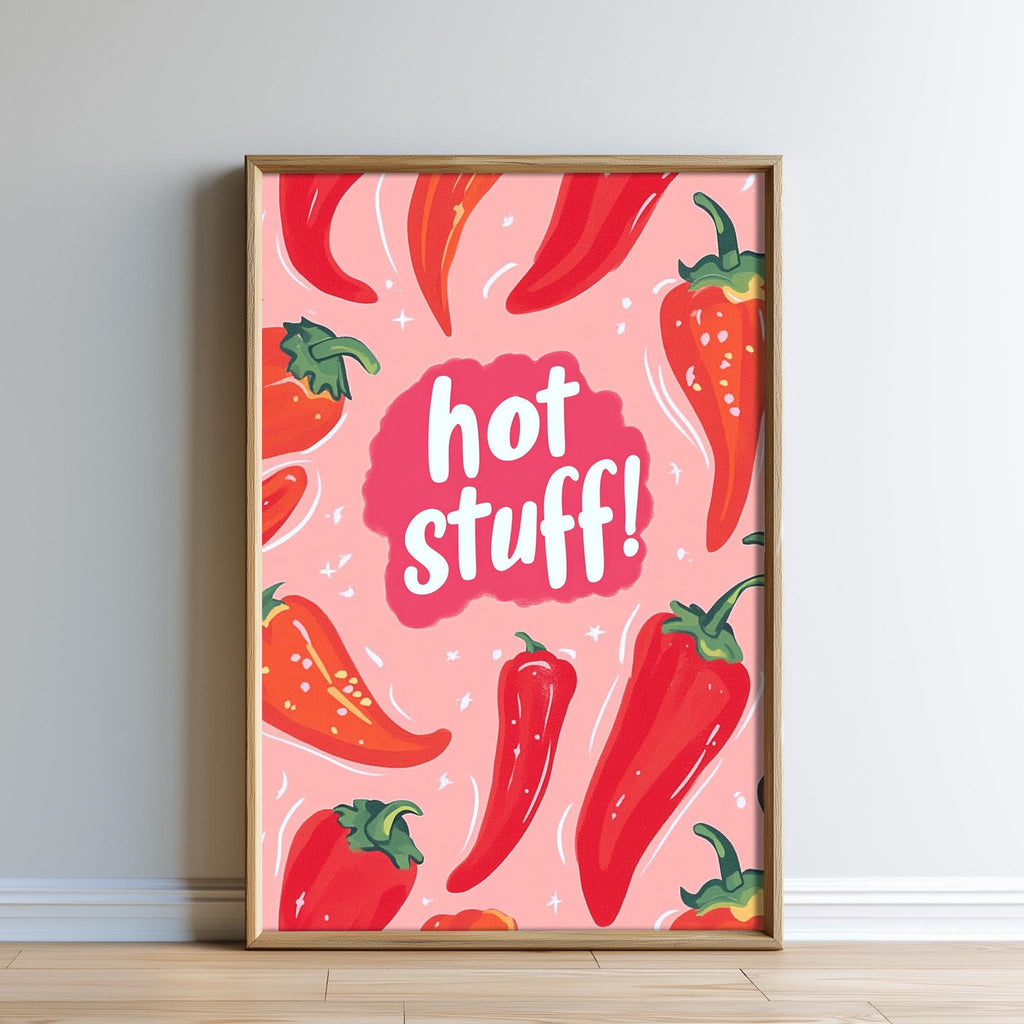 The image is a framed poster with a pink background and various red chili peppers. The poster has a playful and vibrant design, with the phrase "hot stuff!" written in bold white letters.