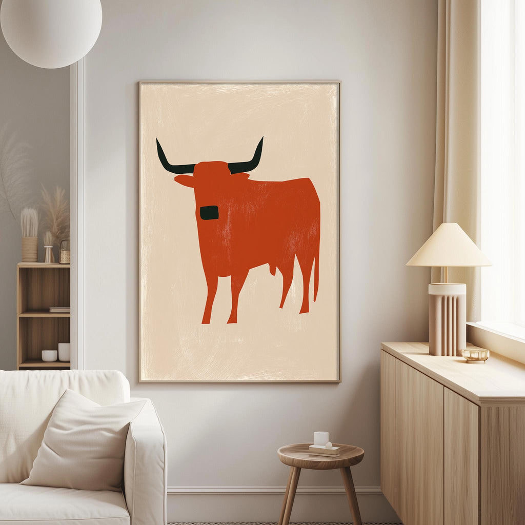 a large, abstract painting of a bull with horns hanging on a wall in a living room.