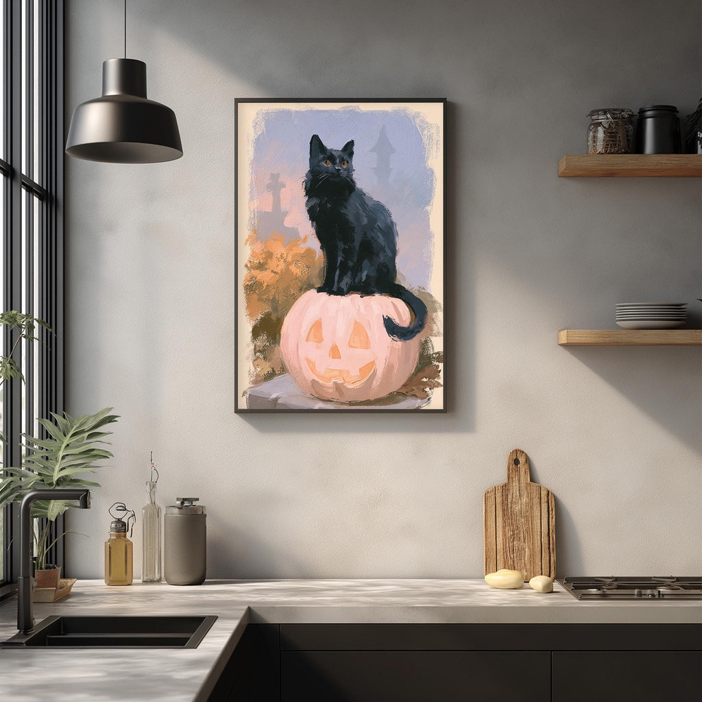 A framed painting of a black cat sitting on a pumpkin is hanging on a wall in a kitchen.