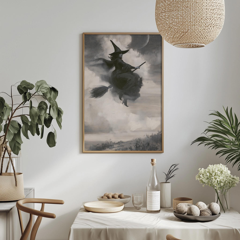 a witch riding a broomstick in a cloudy sky, with a dining table and chairs in the foreground.