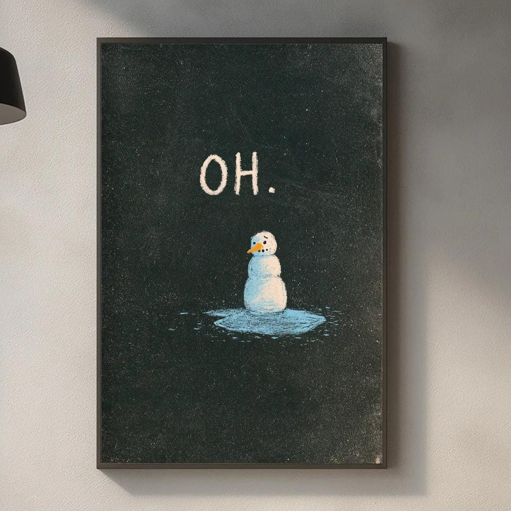 a kitchen counter with various kitchen items, including a cutting board, a soap dispenser, and a plant. Above the counter, there is a framed picture of a snowman with the word "OH" written on it.