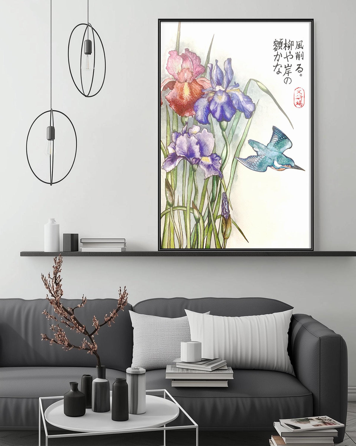 a living room with a gray sofa, a coffee table, and a large framed painting of colorful flowers hanging on the wall above the sofa.
