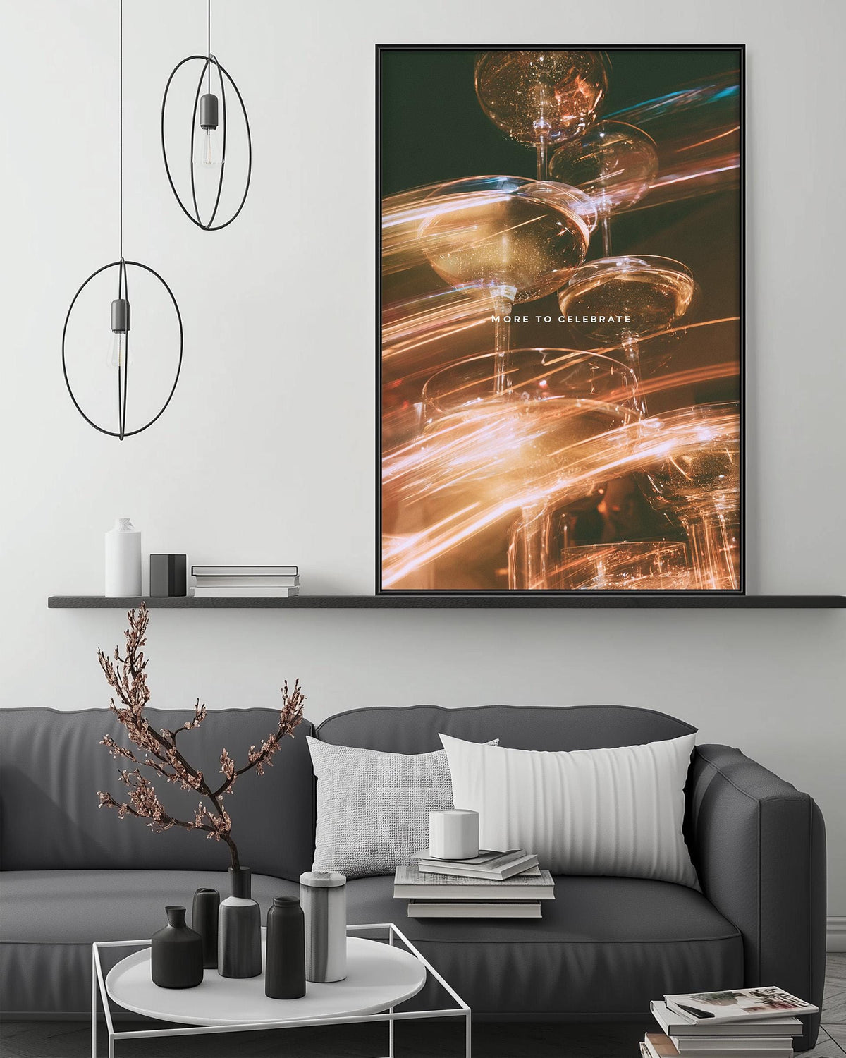 a modern living room with a gray sofa, a coffee table, and a large framed artwork hanging on the wall above the sofa.