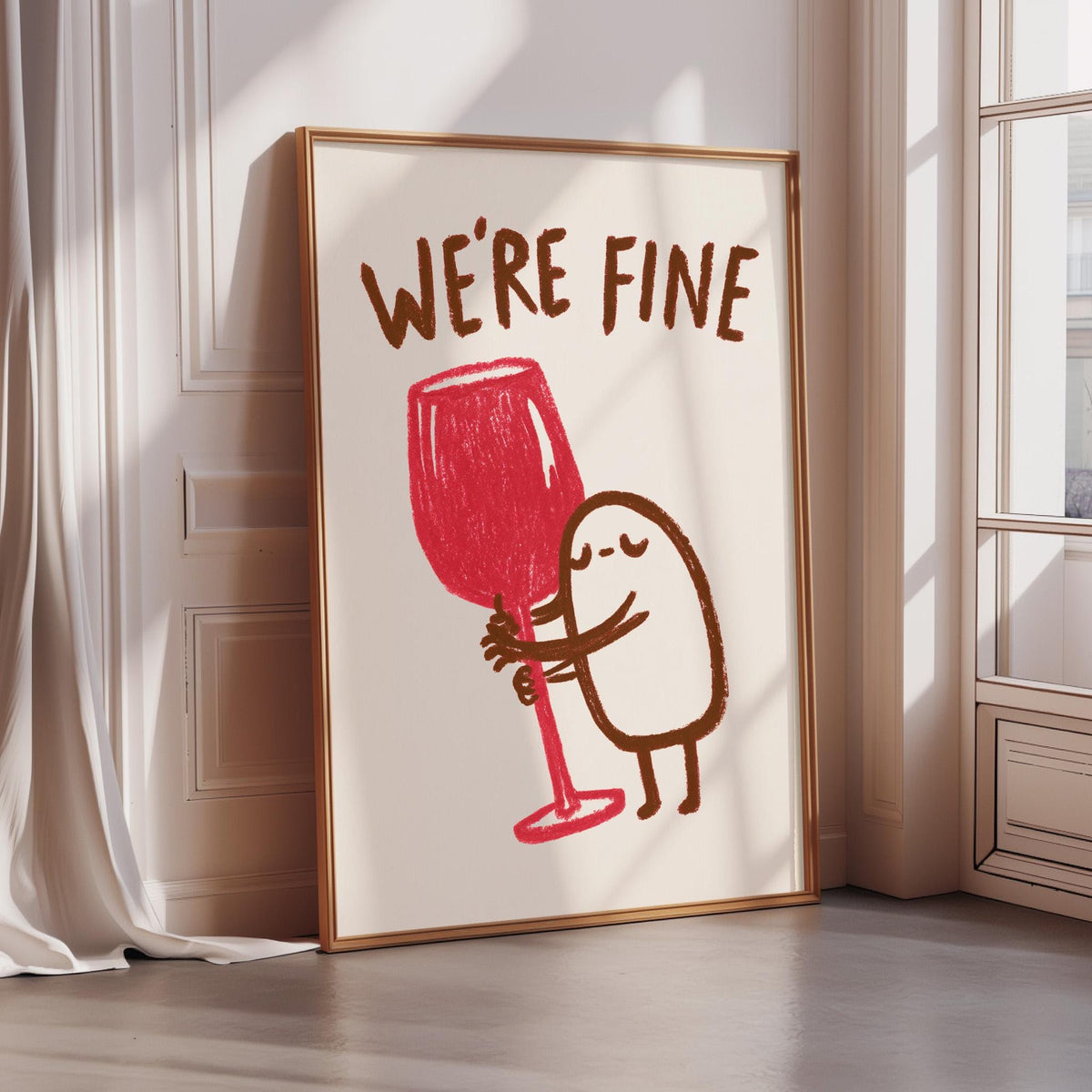 a framed poster with a cartoon character holding a large red wine glass, accompanied by the text "WE'RE FINE".