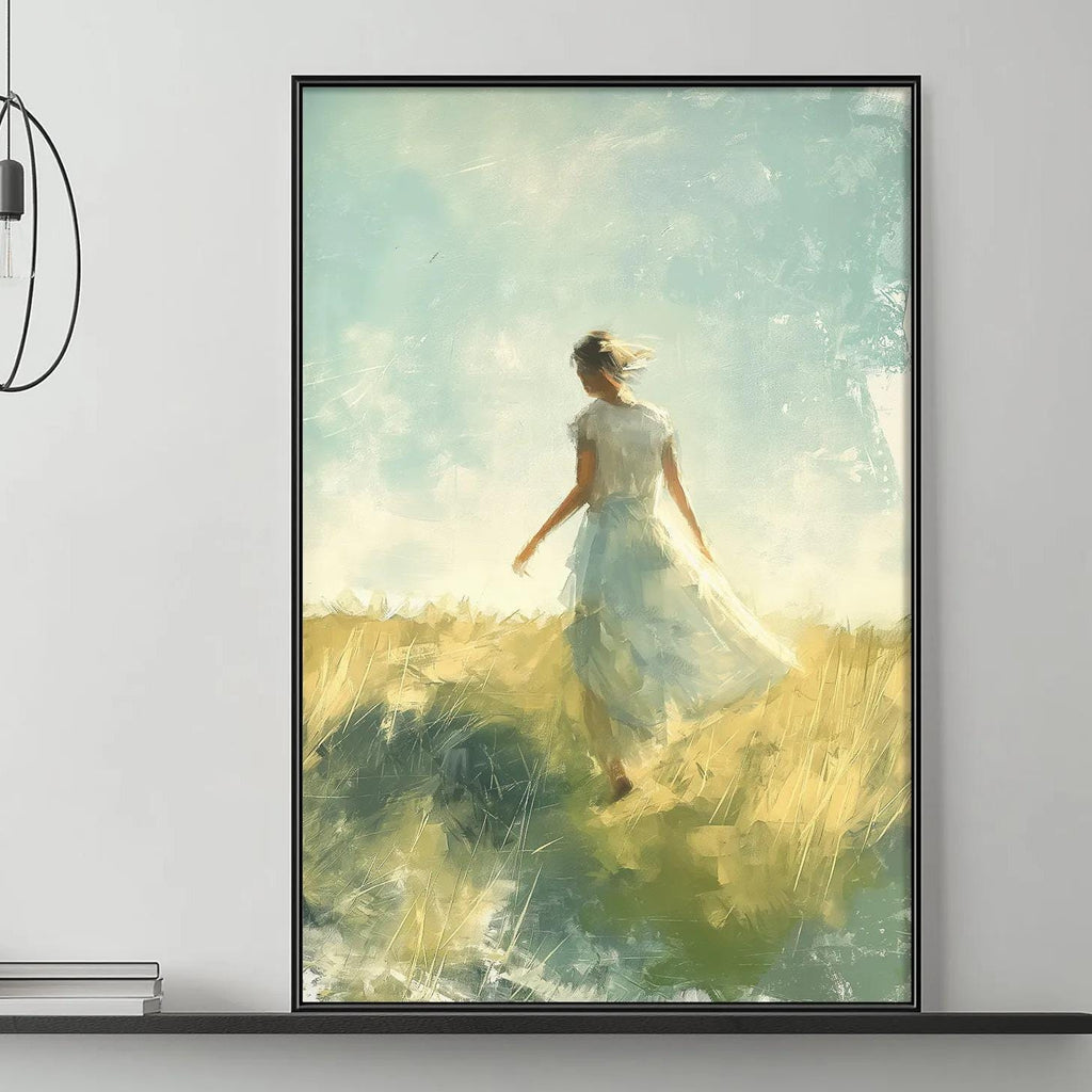 a large painting of a woman in a flowing white dress standing in a field, with a serene and peaceful atmosphere. The painting is displayed on the wall above a gray couch, which is adorned with decorative items such as a potted plant, vases, and books. The overall setting appears to be a cozy and inviting living space.