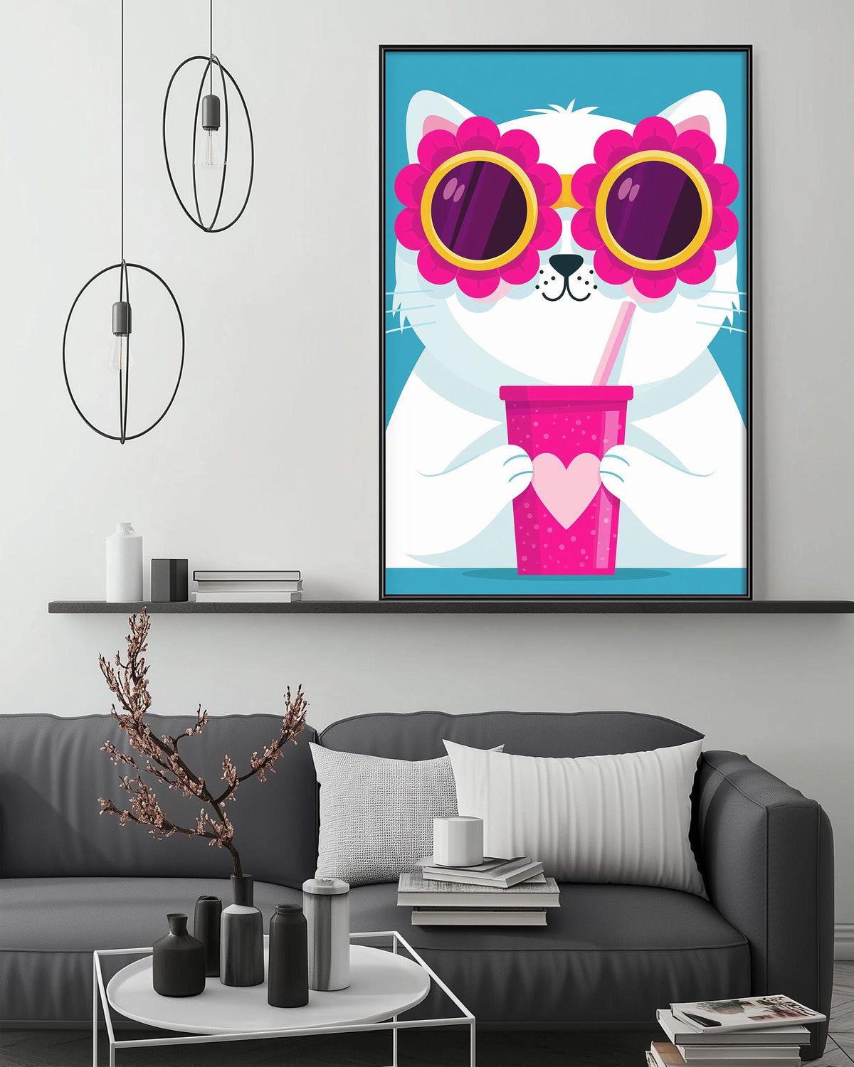a cozy living room with a gray couch, a coffee table, and a framed poster of a cat wearing sunglasses and holding a pink drink.