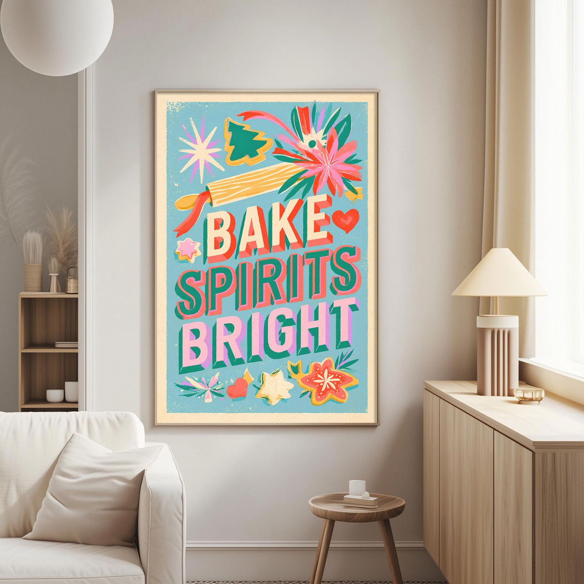 a vibrant and colorful poster with the text "BAKE SPIRITS BRIGHT" displayed prominently on it. The poster is hanging on a wall in a living room setting, with a white couch and a small table nearby.