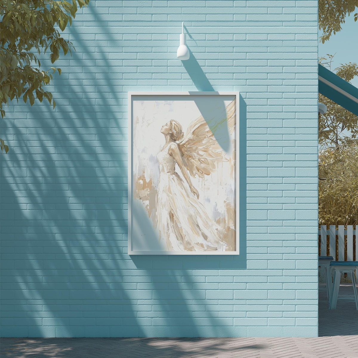 a blue brick wall with a framed painting of a woman with wings hanging on it.