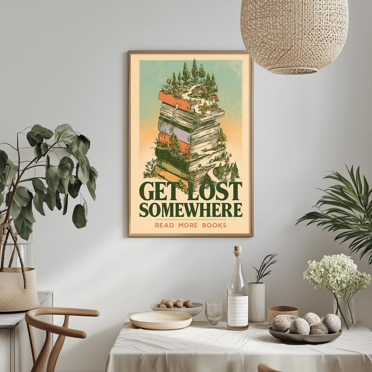 a framed poster with the text "GET LOST SOMEWHERE READ MORE BOOKS" hanging on a wall above a dining table with various items on it.