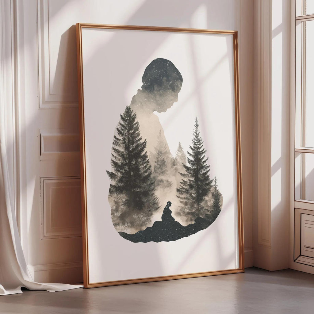 a framed artwork depicting a silhouette of a person standing in front of a forest of pine trees.