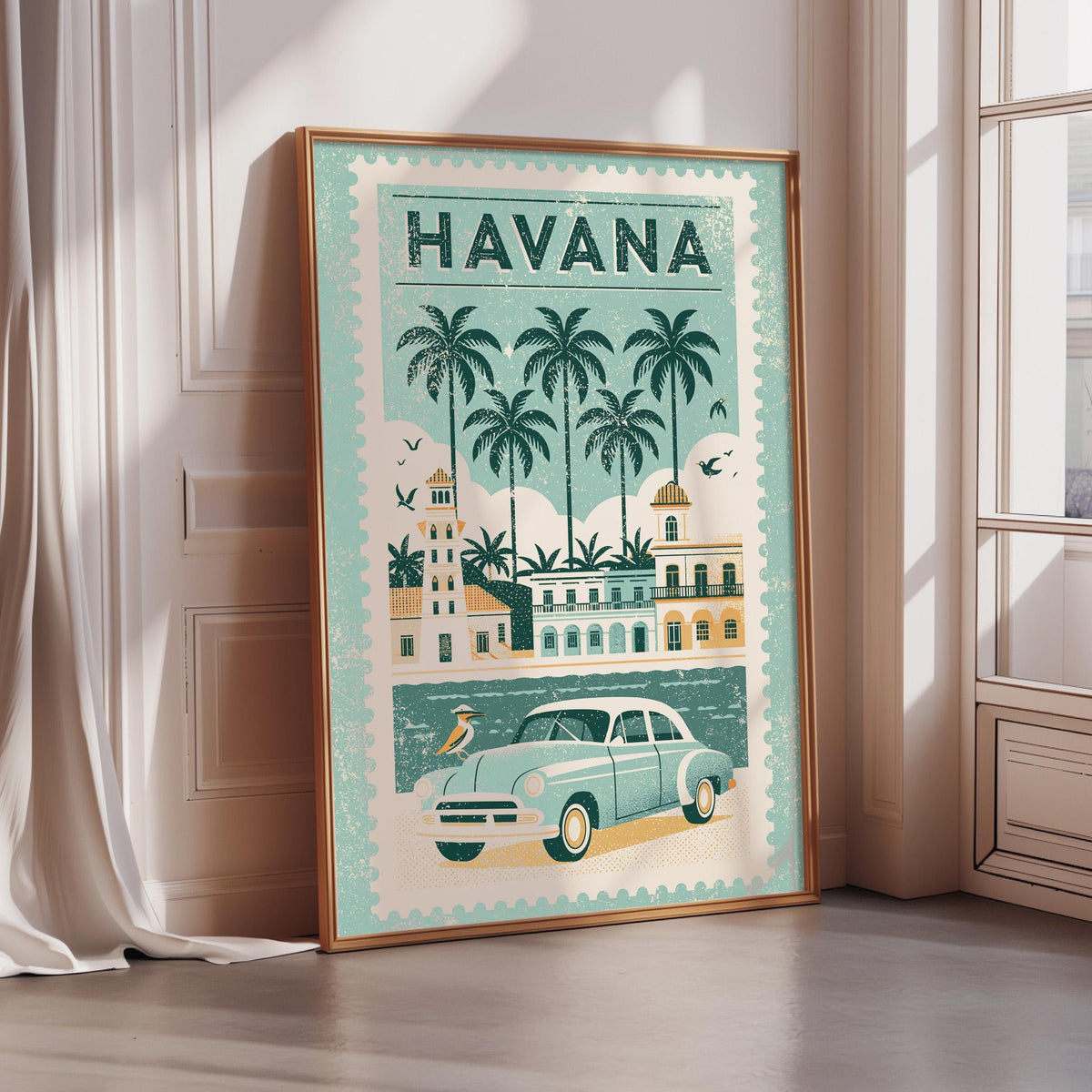 A framed poster of Havana, Cuba, featuring a vintage car, palm trees, and buildings, is displayed on a wall.