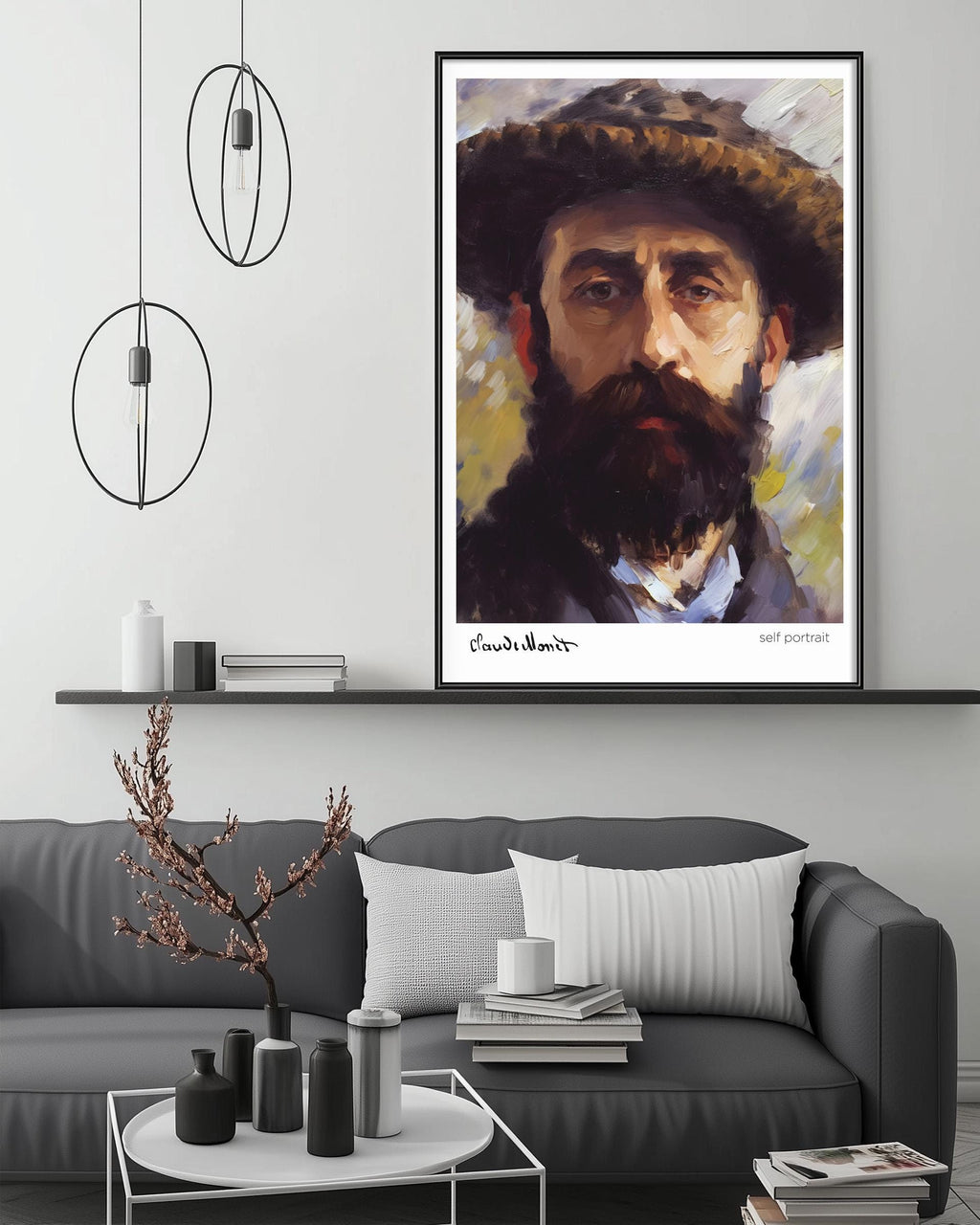 a framed painting of a man with a beard hanging on a wall above a gray couch in a living room setting.