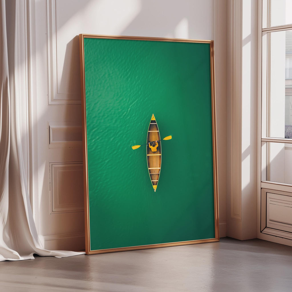 A large framed artwork depicting a canoe on a green background, with a window and white curtain in the background.