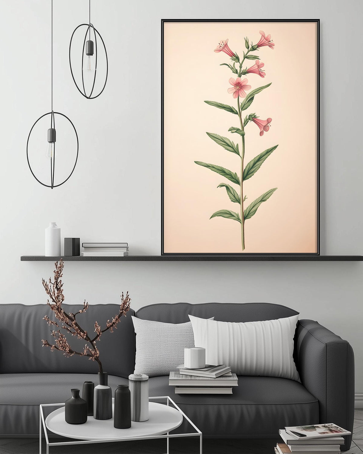 a living room with a gray sofa, a coffee table, and a large framed print of a pink flower on the wall above the sofa.